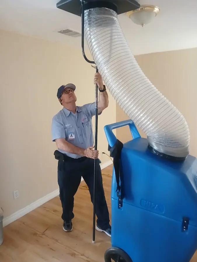 Furnace Tune-Up technician using HEPA equipment in Airmont